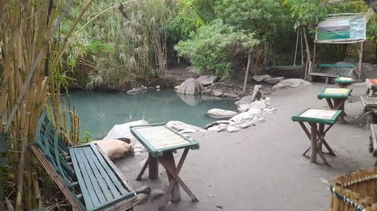 Seating area by the hot springs pool