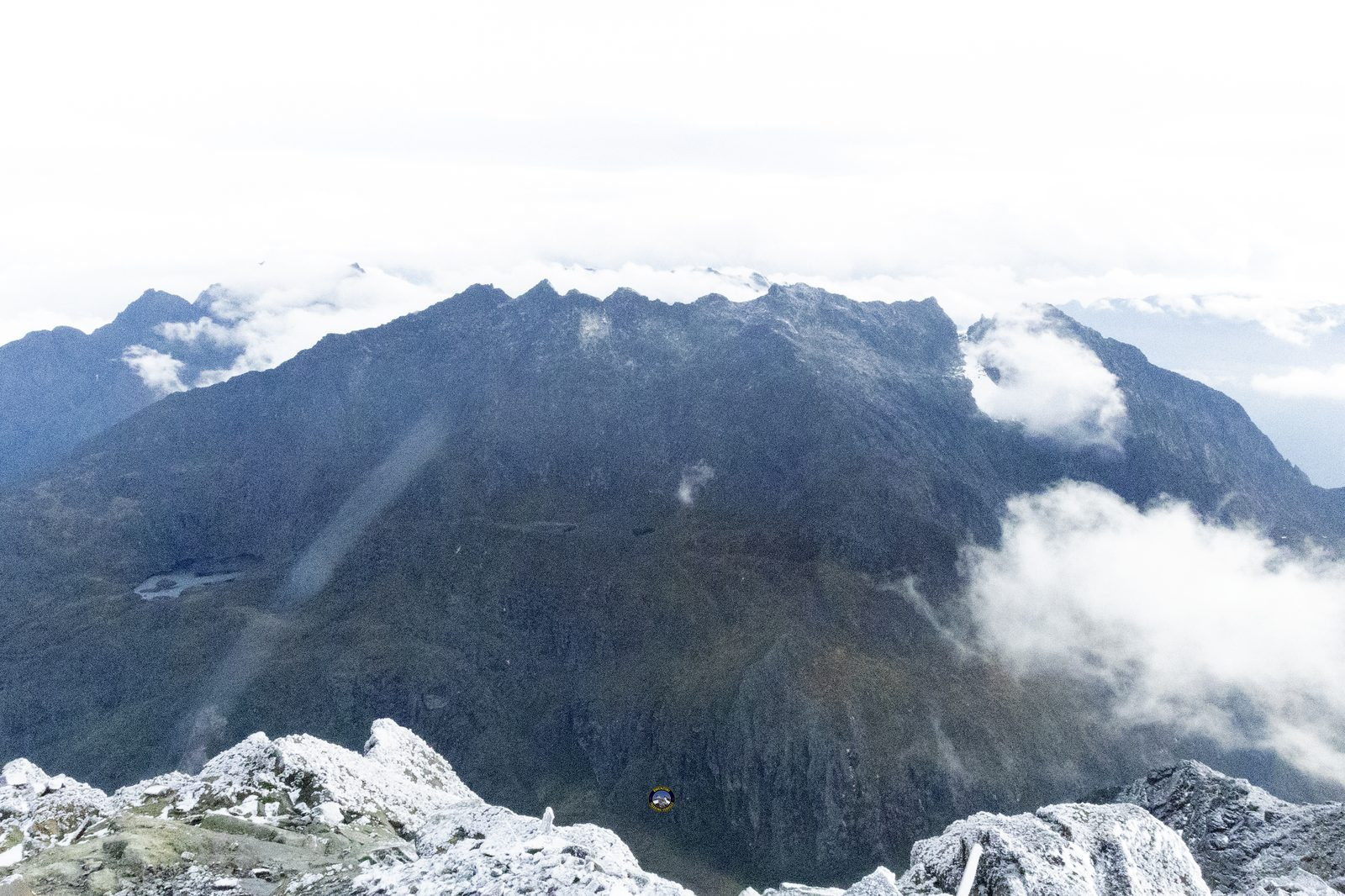 Climbers near the Margherita Peak summit sign
